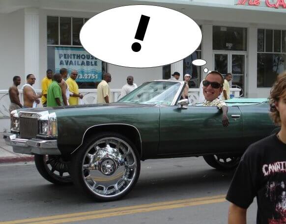 Photo illustration of Founder, CEO, President, Sales Guy Peter Jewett driving a lifted convertible with oversized chrome rims